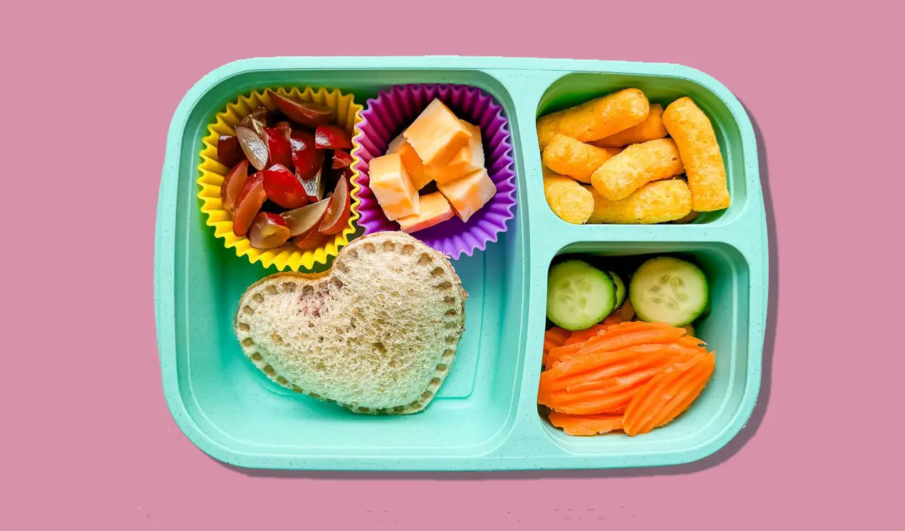 A lunchbox with homemade uncrustable, grapes, Colby jack cheese, Hippeas Cheese Puffs, carrot chips (love these) and cucumber slices. A lunchbox with homemade uncrustable, grapes, Colby jack cheese, Hippeas Cheese Puffs, carrot chips (love these) and cucumber slices.